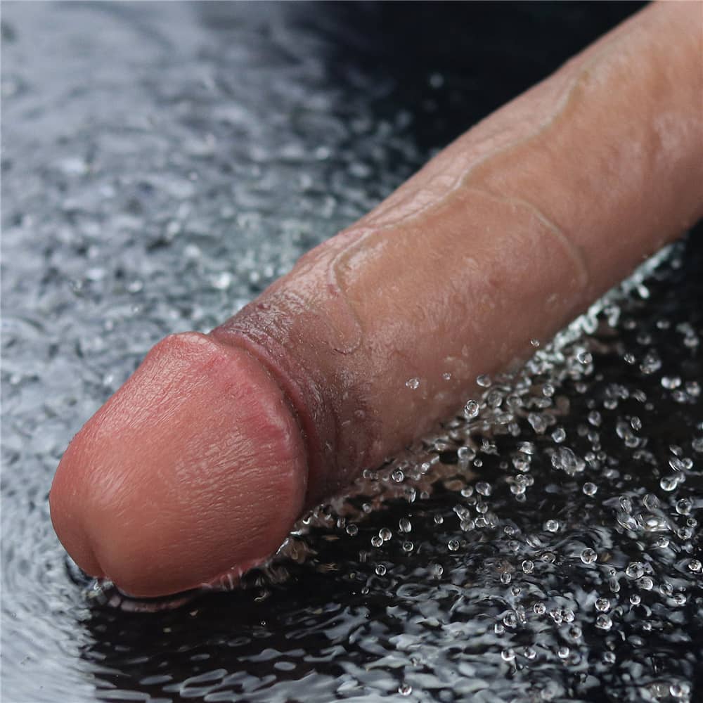 The 9 inches rechargeable silicone vibrating dildo is vibrating in the water