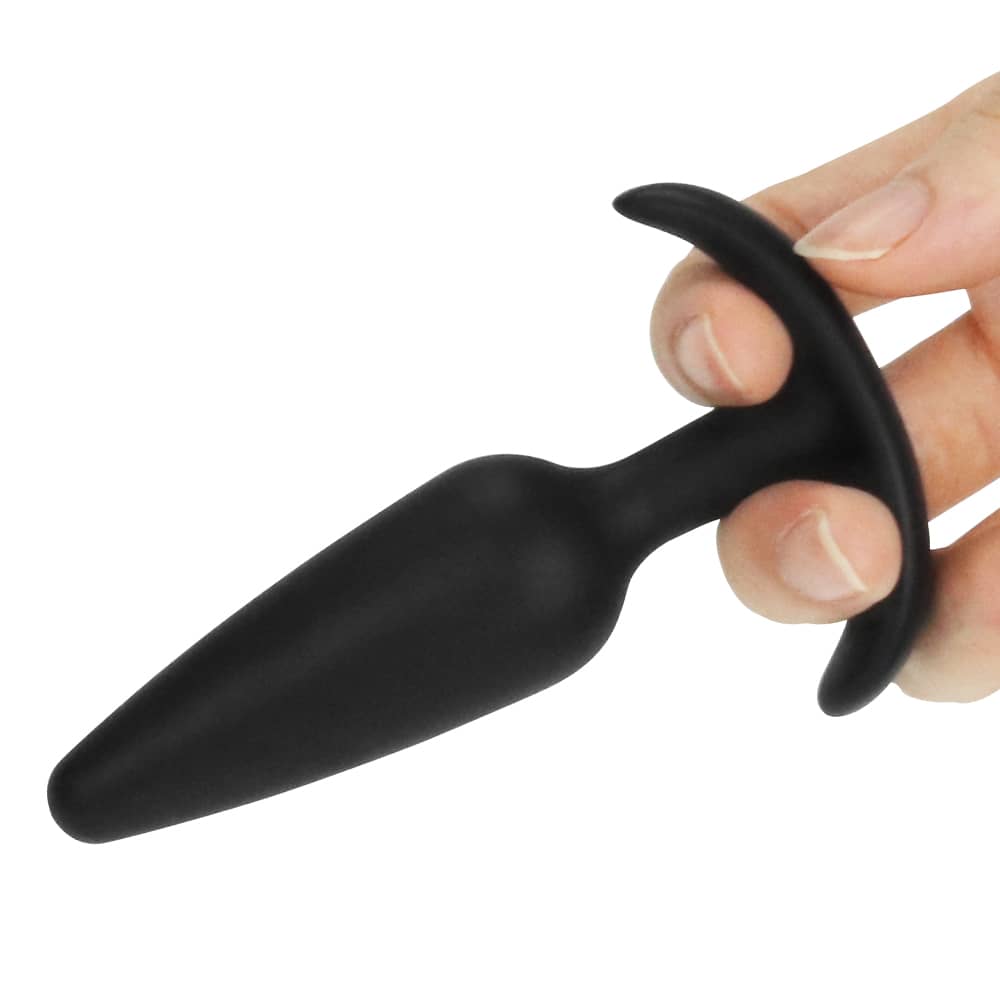 A man holds the black lure me classic anal plug s