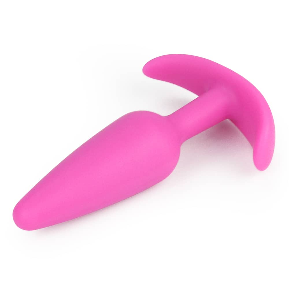 The pink lure me classic anal plug s lays flat