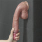 The 10.5 inches platinum silicone cock bends softly downward