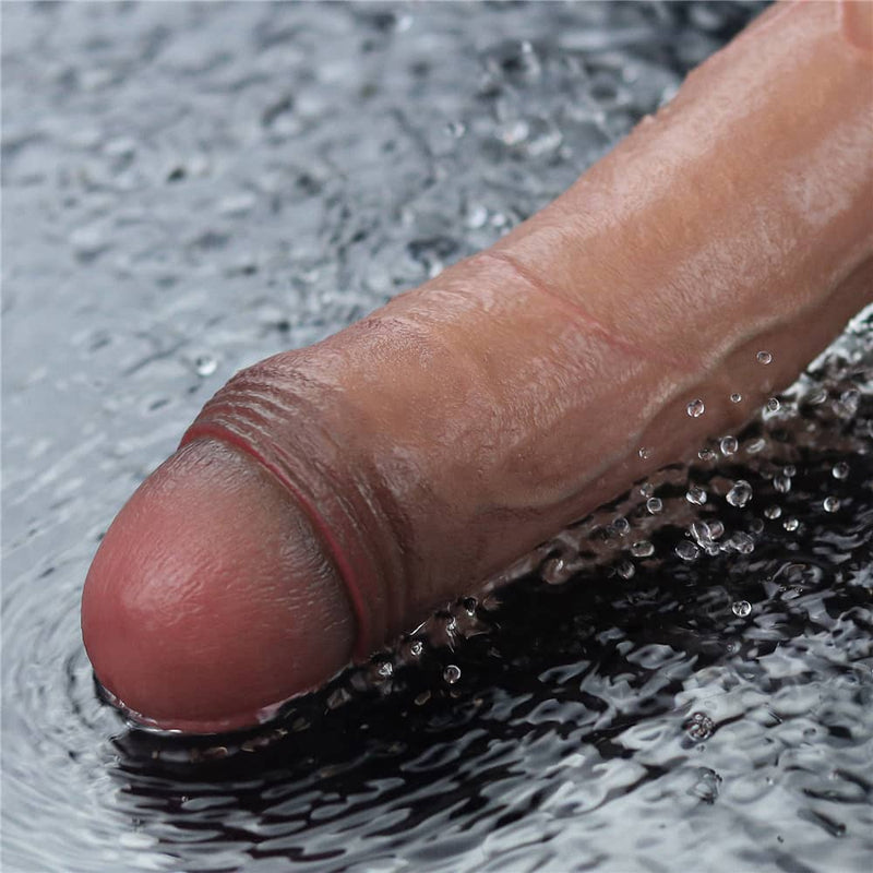 The 10.5 inches rechargeable silicone vibrating dildo is vibrating in the water