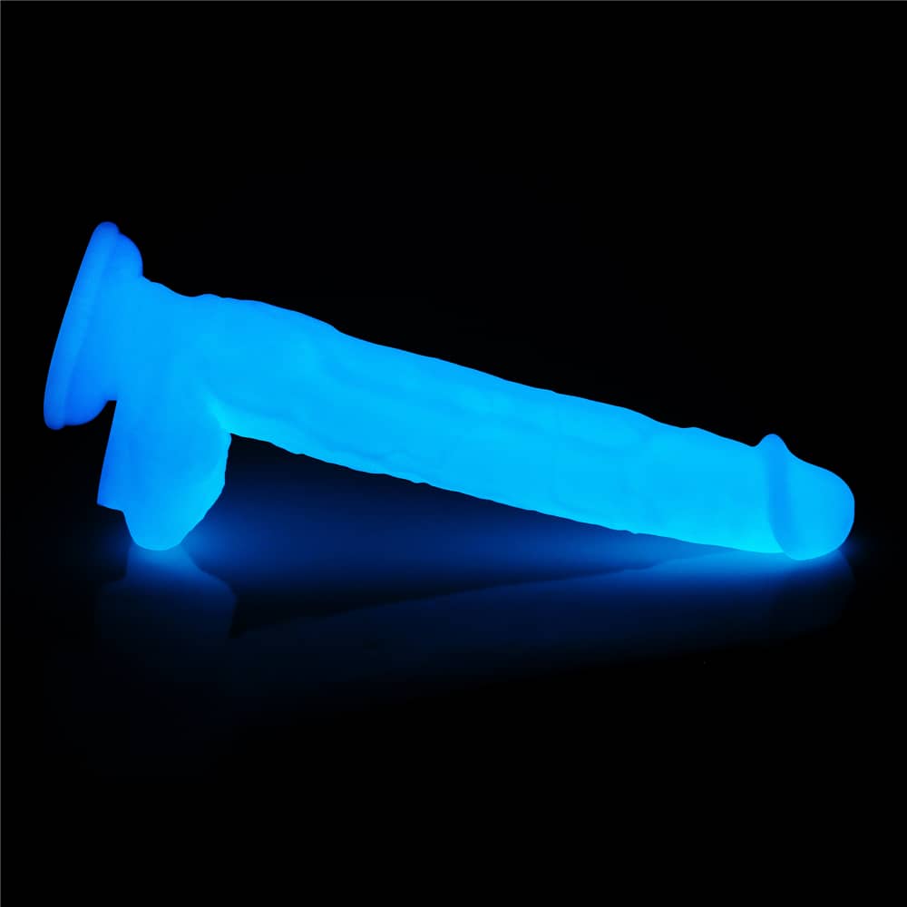 The 10.5 inches lumino play silicone dildo lays flat when emits blue fluorescence