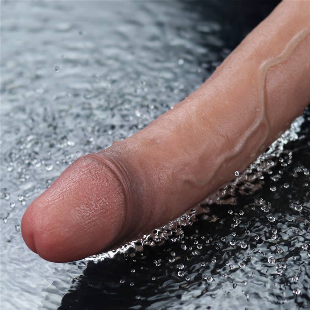 The 11 inches rechargeable silicone vibrating dildo is vibrating in the water