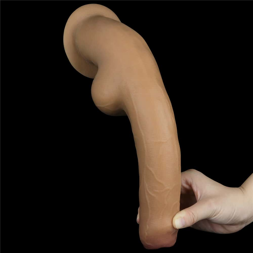 The 11 inches dual layered handle foreskin cock bends softly downward