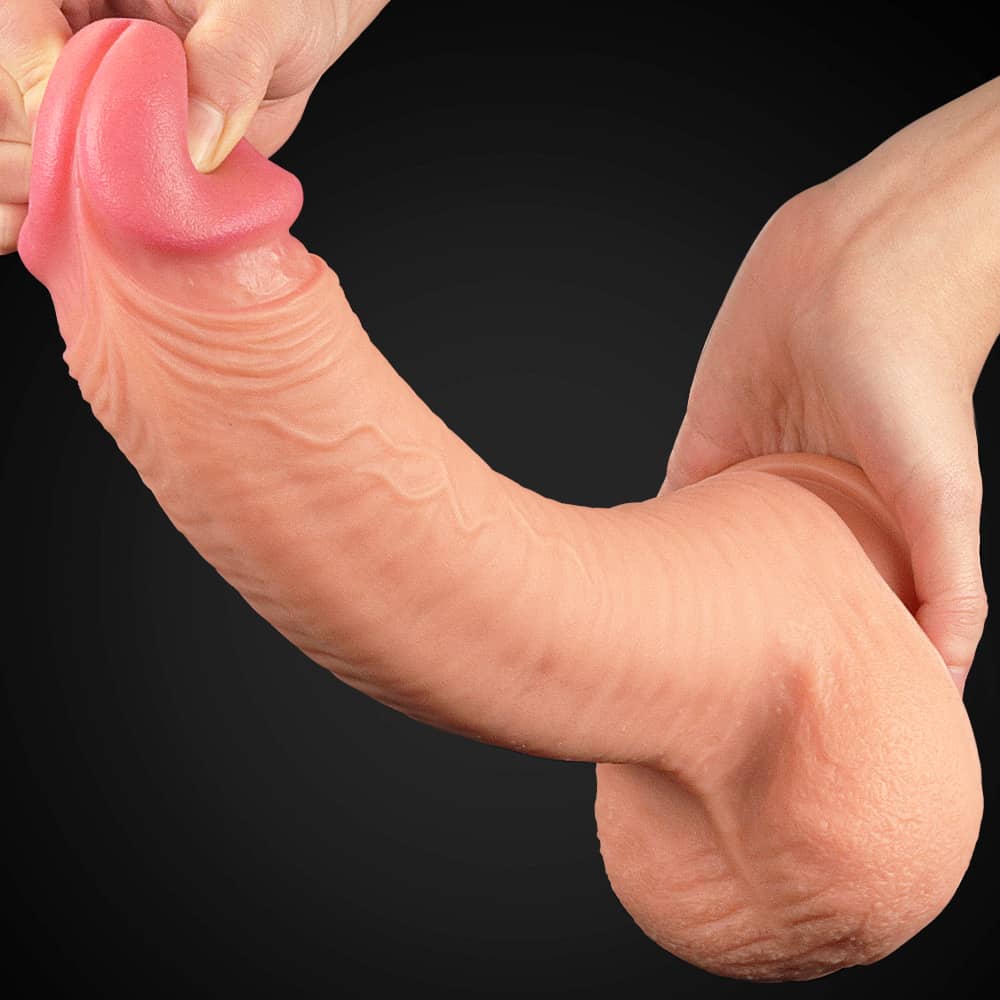 The 12 inches king size dual layer silicone dildo adorned with raised veins and a bulbous head