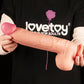 A men holds the 12 inches dual density silicone dildo