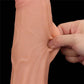 A person pinches the sliding skin of the 12 inches king sized sliding skin dual layer dong
