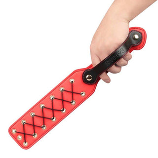 The 15 inches rebellion reign rope paddle features a detachable securing strap ensuring a firm grip