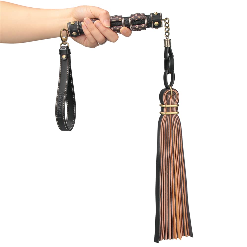 A man holds the rebellion reign flogger