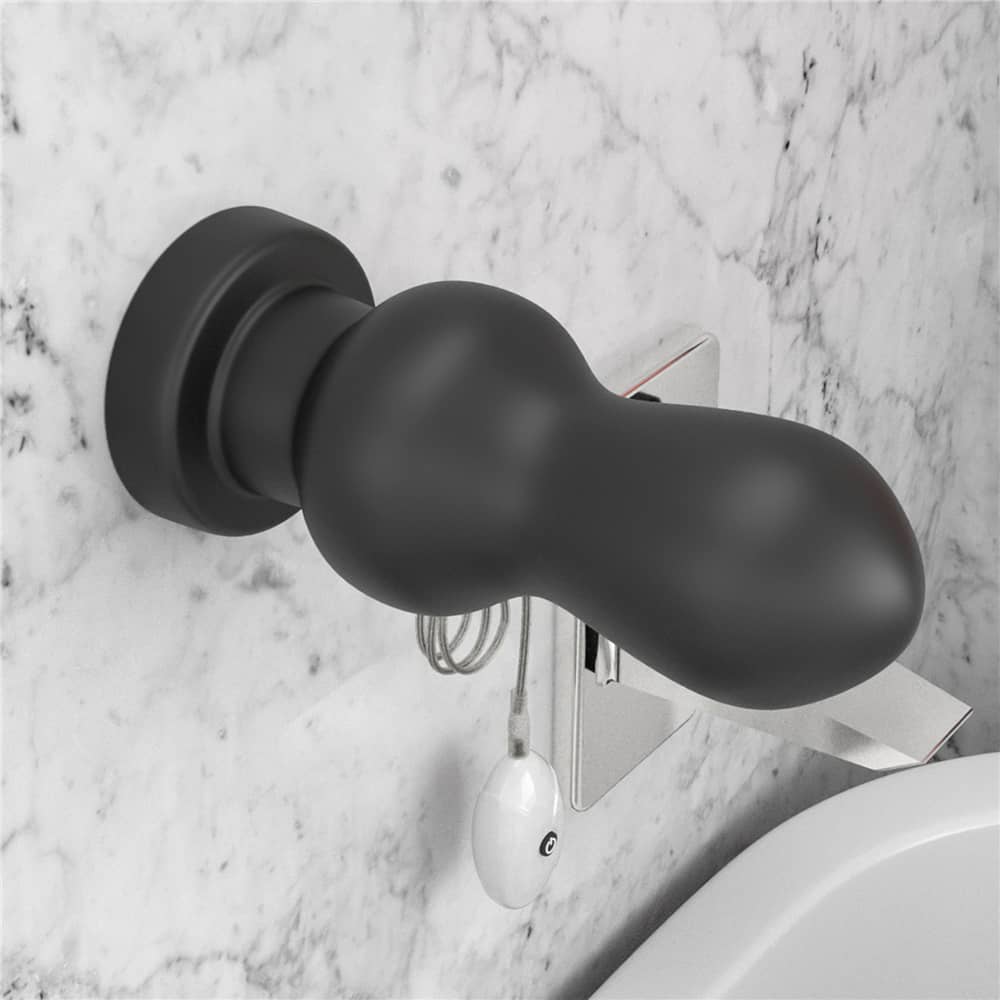 The 7 inches king sized vibrating anal rammer is firmly attached to the wall with its suction cup