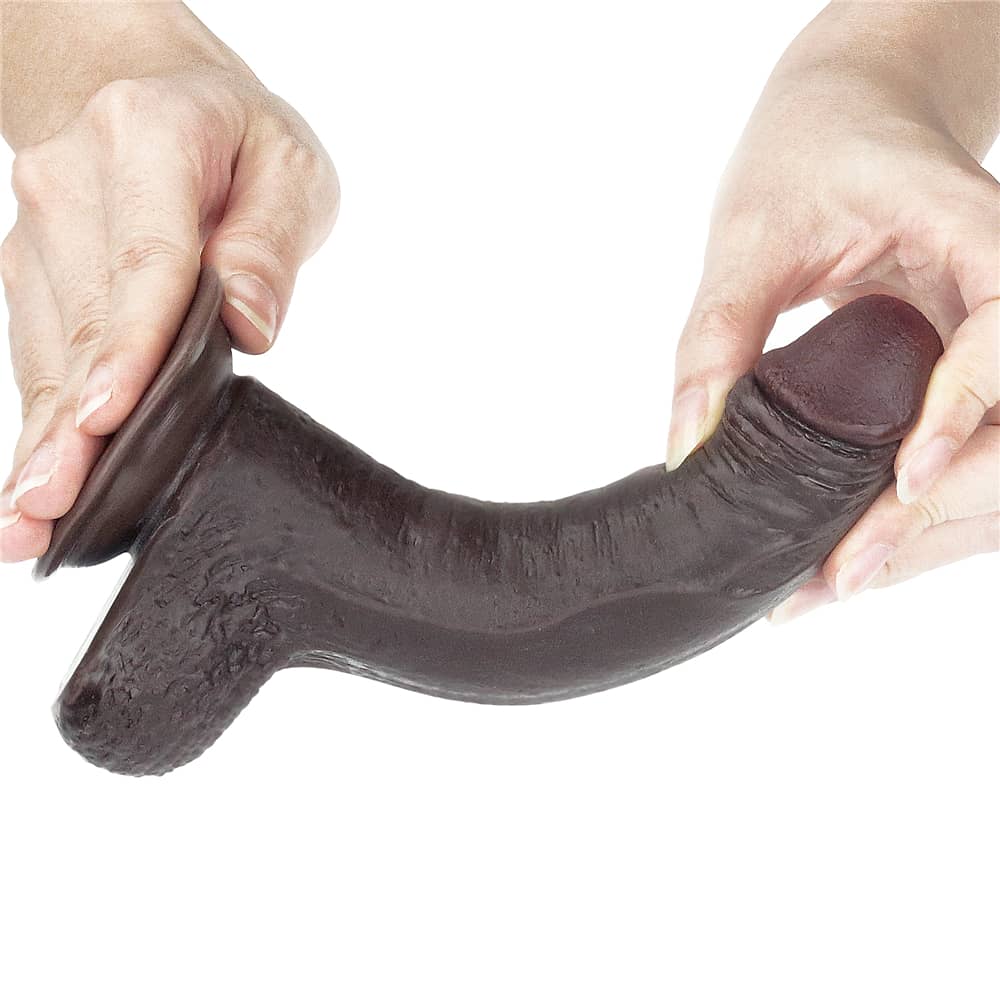 The 7 inches sliding skin dual layer black dildo bends ultra softly