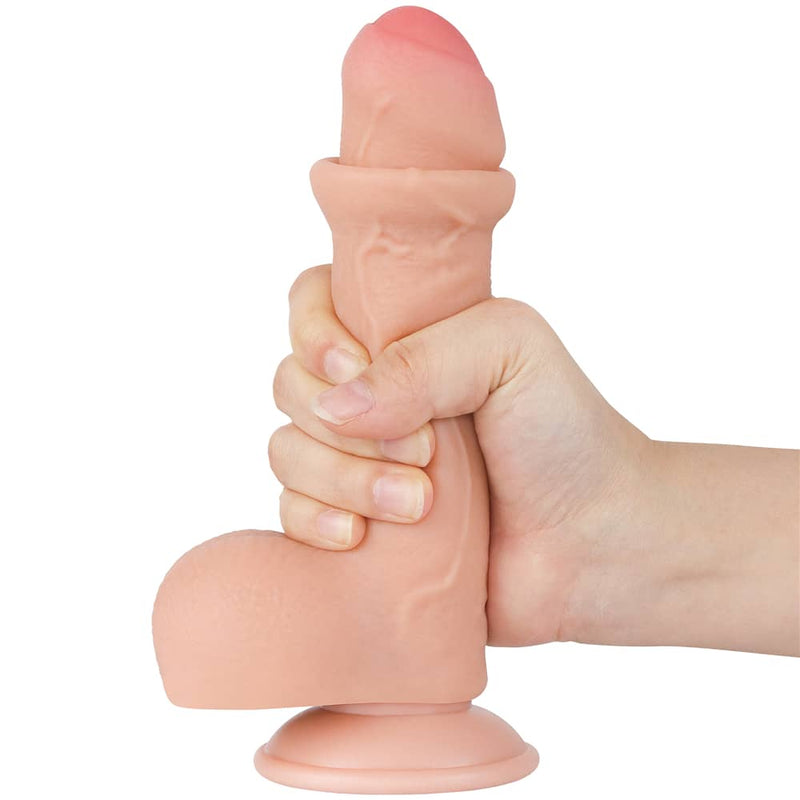 A man holds the 7 inches sliding skin realistic uncut dildo