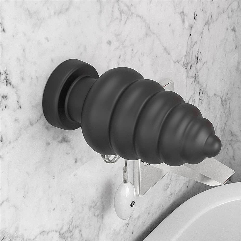 The 7 inches king sized vibrating anal cracker is firmly attached to the wall with its suction cup