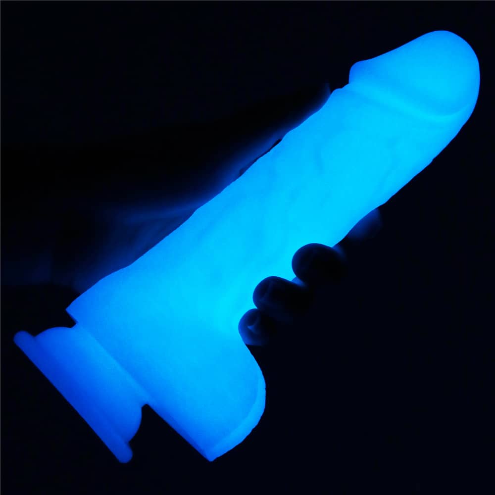 A man holds the 7.5 inches lumino play silicone dildo