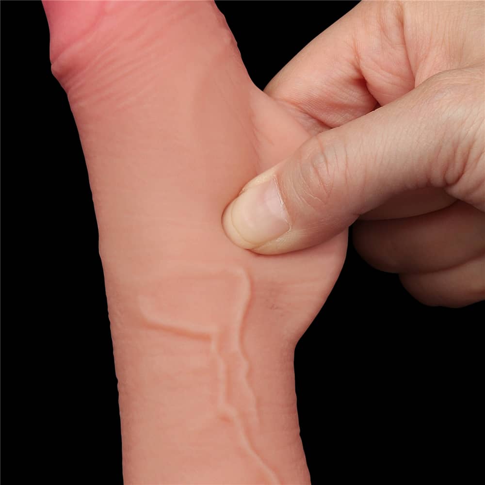 A person pinches the sliding skin of the 7.5 inches flesh sliding skin dual layer dong 