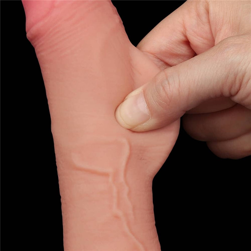 A person pinches the sliding skin of the 7.5 inches flesh sliding skin dual layer dong 