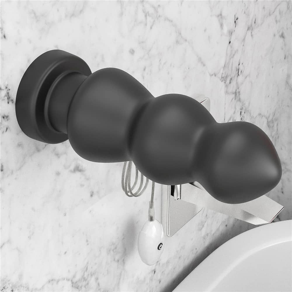 The 7.8 inches king sized vibrating anal rigger is firmly attached to the wall with its suction cup