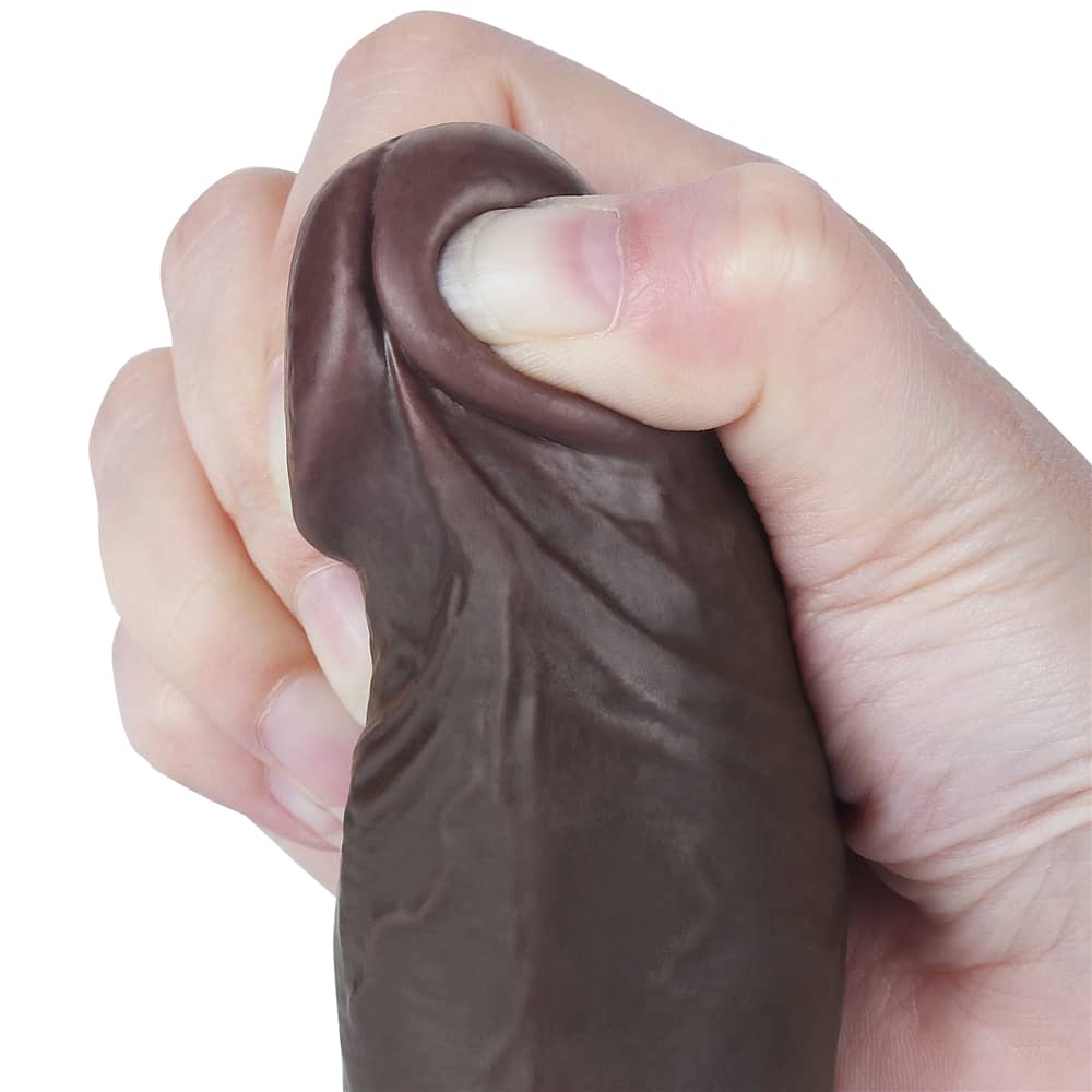 The bulging but soft head of the 8 inches sliding skin black dong 