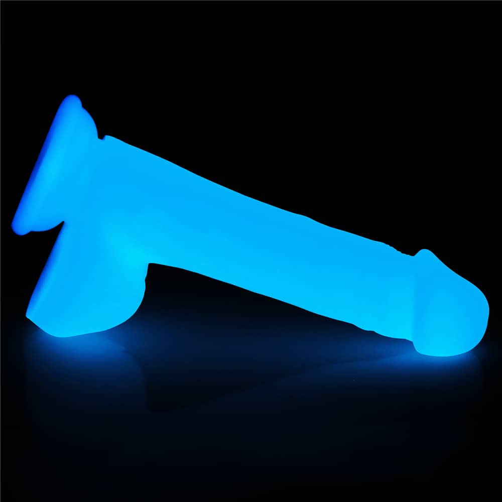 The 8 inches lumino play silicone dildo is put on the floor