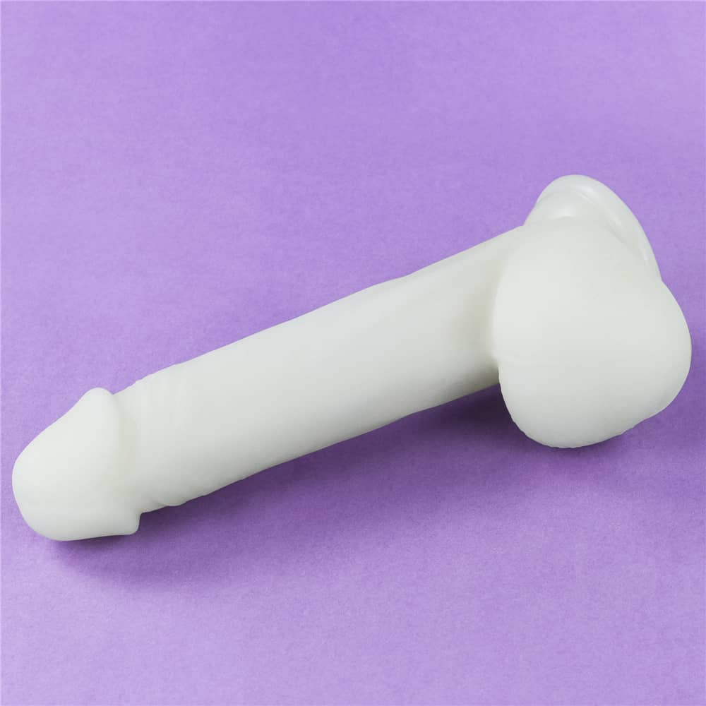 The 8 inches lumino play silicone dildo lays flat without blue fluorescence