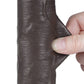 A person pinches the sliding skin of the 8 inches sliding skin dual layer dong black