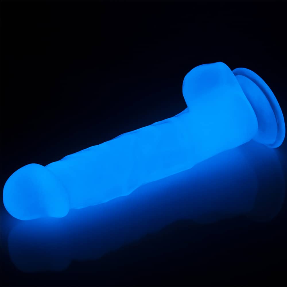 The 8.5 inhces lumino play dildo lays flat glowing the blue light