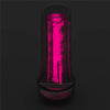 The 8.5 inches pink glow lumino play masturbator is is upright in the dark with pink fluorescence