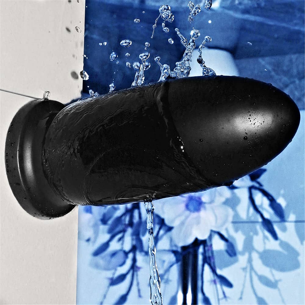 The 9" king size bomber butt plug is firmly attached to the wall with its suction cup