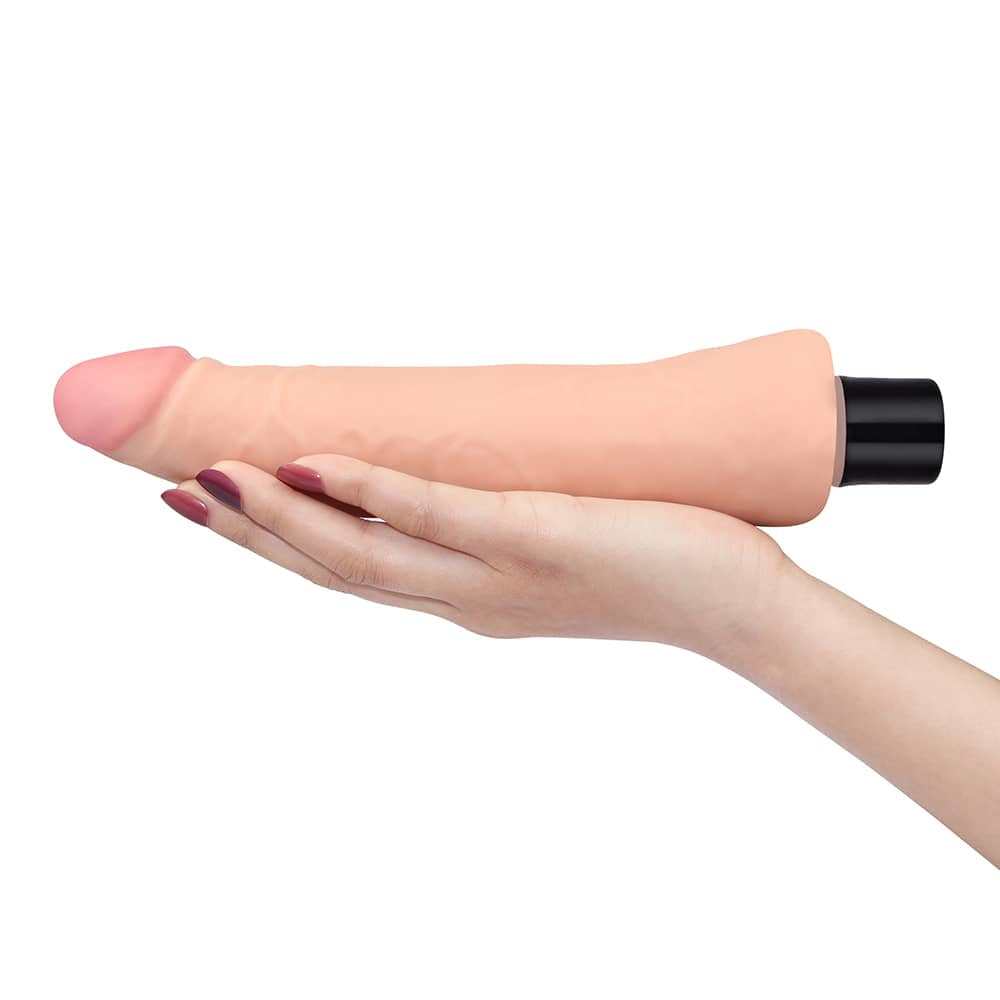The 9 inches real softee vibrating dildo lays flat on the palm