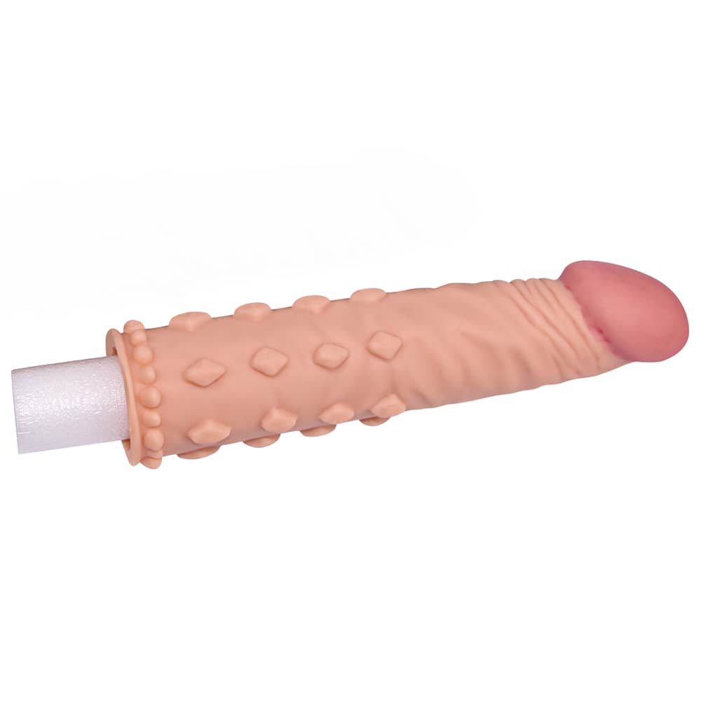 The add 2 inches pleasure x tender flesh penis sleeve provides an additional 2 inches in length