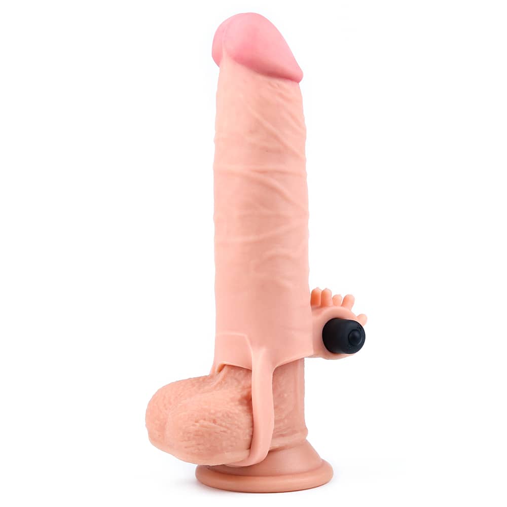 The flesh add 2 inches vibrating penis sleeve worn on dildo