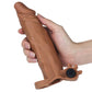 A man holds the brown add 2 inches vibrating penis sleeve