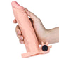 A man holds the flesh add 2 inches vibrating penis sleeve