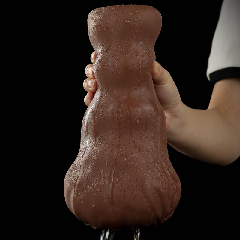 A man holds the aliens pie male masturbator to suck the dildo