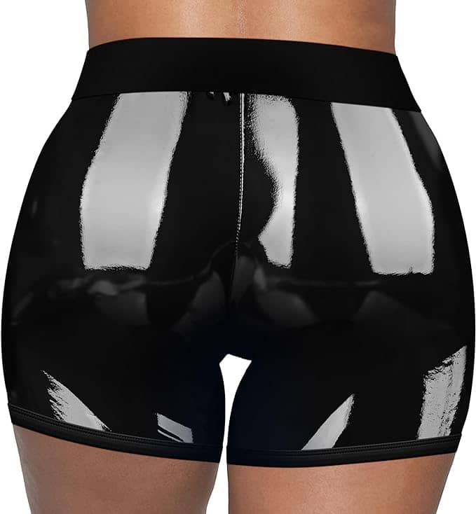 The back of a woman wears the black faux leather strap on shorts