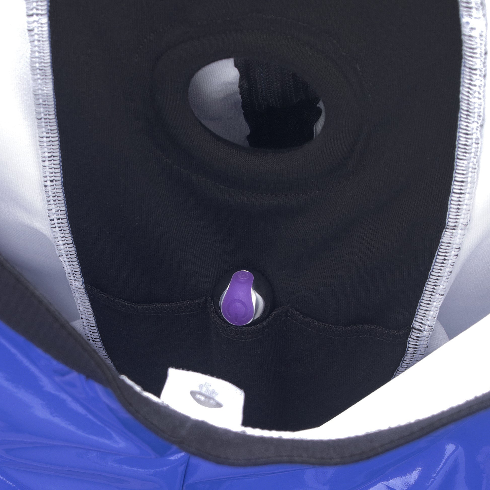 The mini vibrator is put in a hidden pocket at the bottom of the blue faux leather strap on shorts
