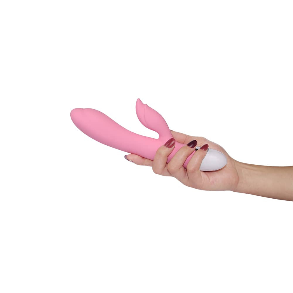 A woman holds the dreamer ii rechargeable vibrator