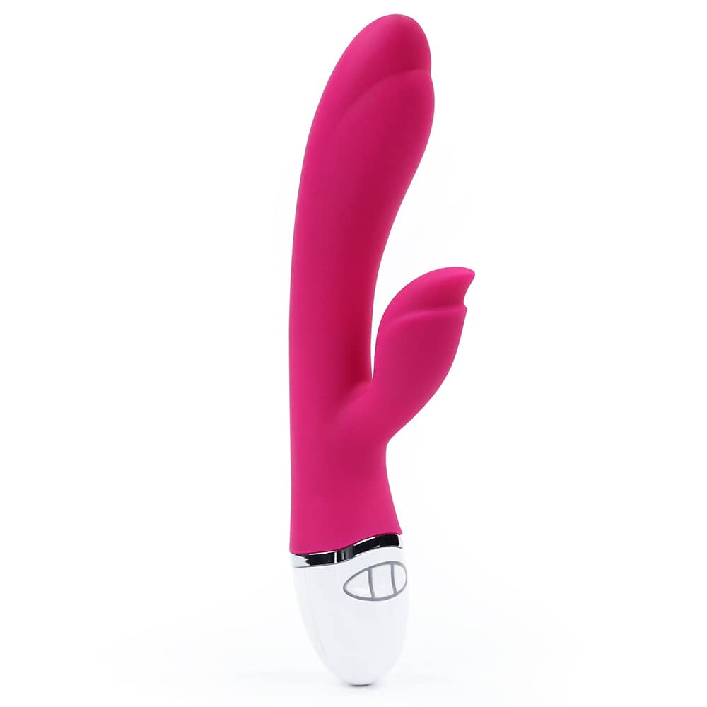 The pink rechargeable vibrator is upright