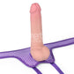 Put a dildo into the O ring of the easy strap on harness polka dots purple