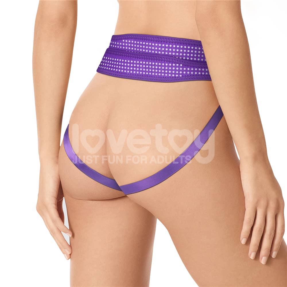 The back of wearing the easy strap on harness polka dots purple