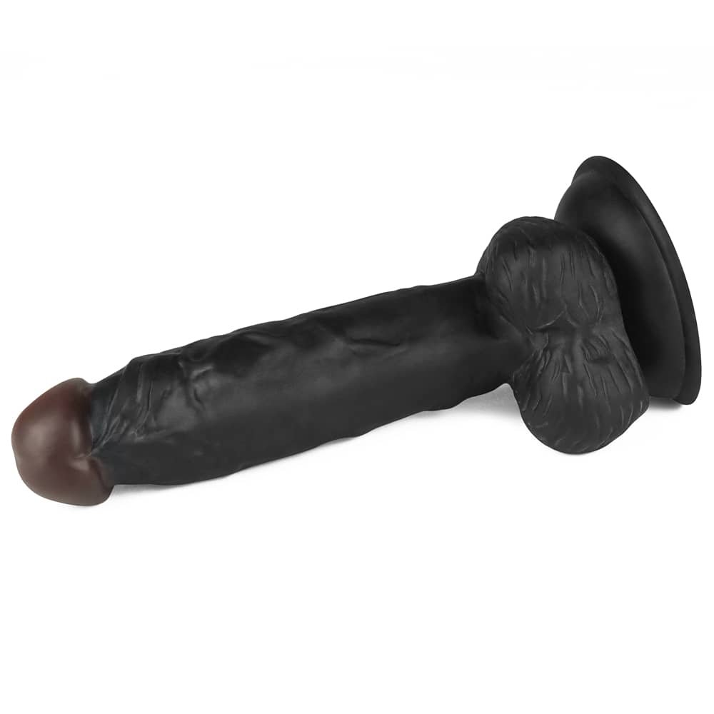 The dildo of the 7.5 inches black dildo easy strapon set lays flat