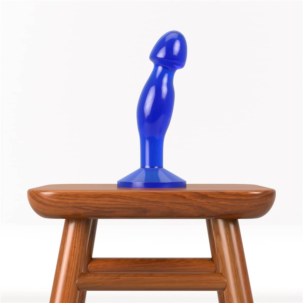 The 6.5 inches blue flawless clear prostate plug anal toy is put on the chair