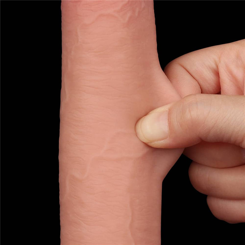 A person pinches the sliding skin of the 9 inches sliding skin dual layer flesh dong 