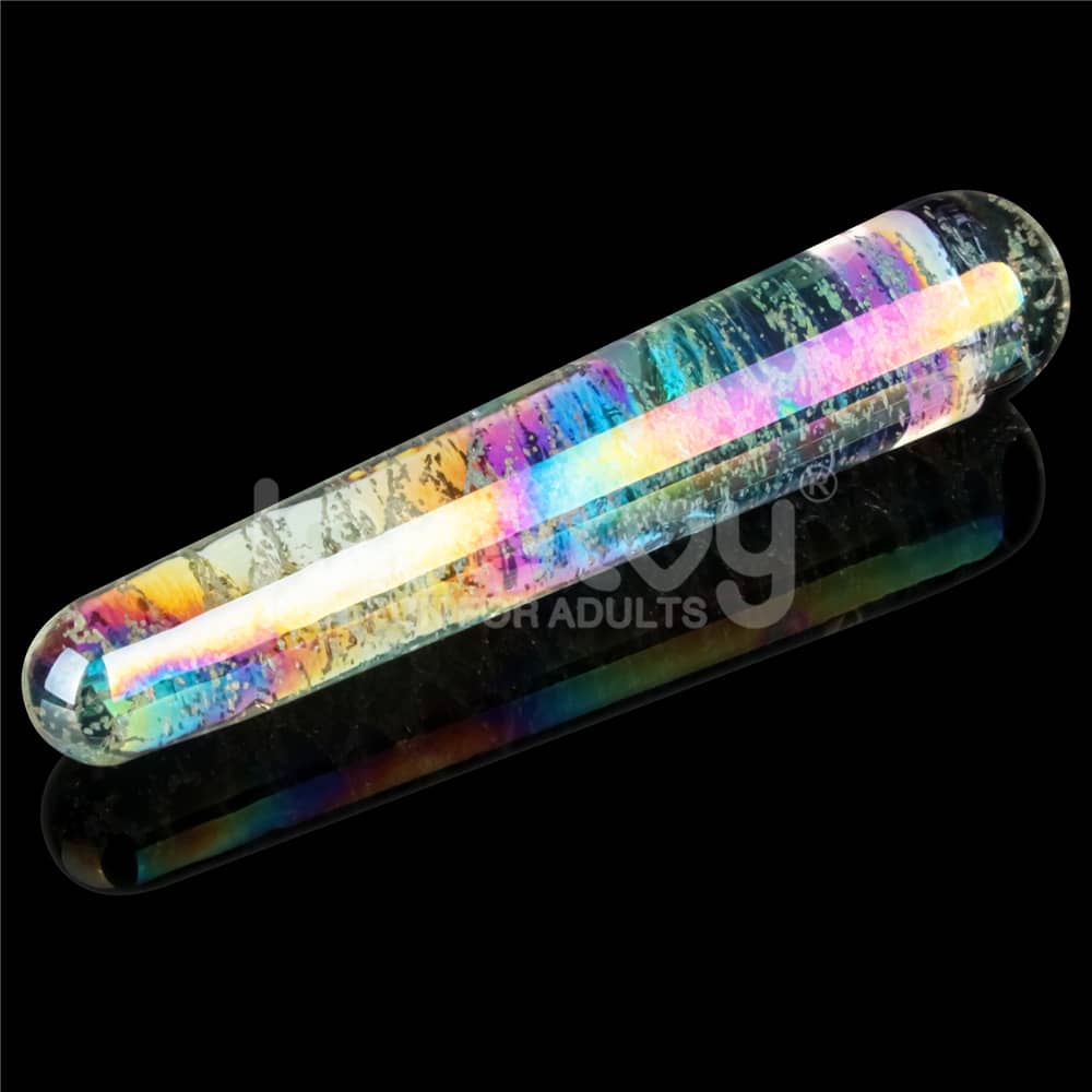 The luminous twilight gleam glass slim dildo features a luminous rainbow surface