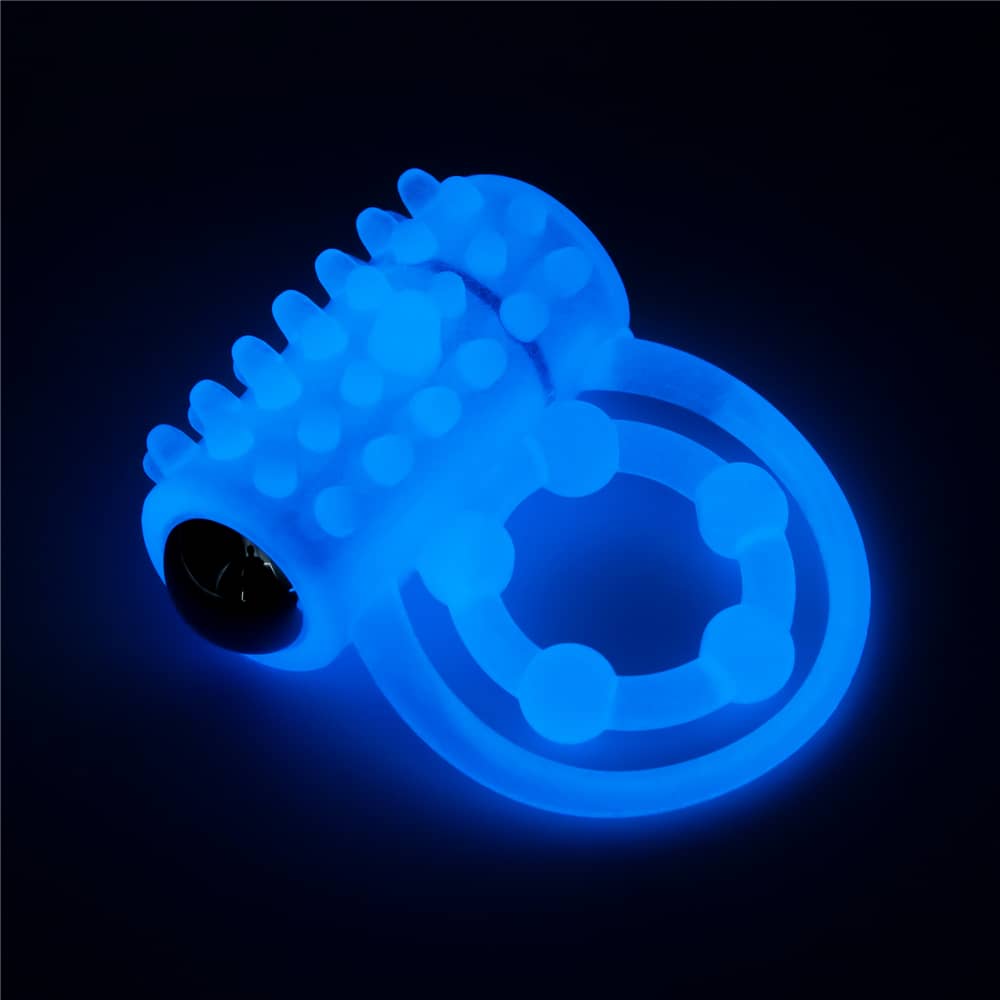 The lumino play vibrating penis ring glows the blue light in the dark