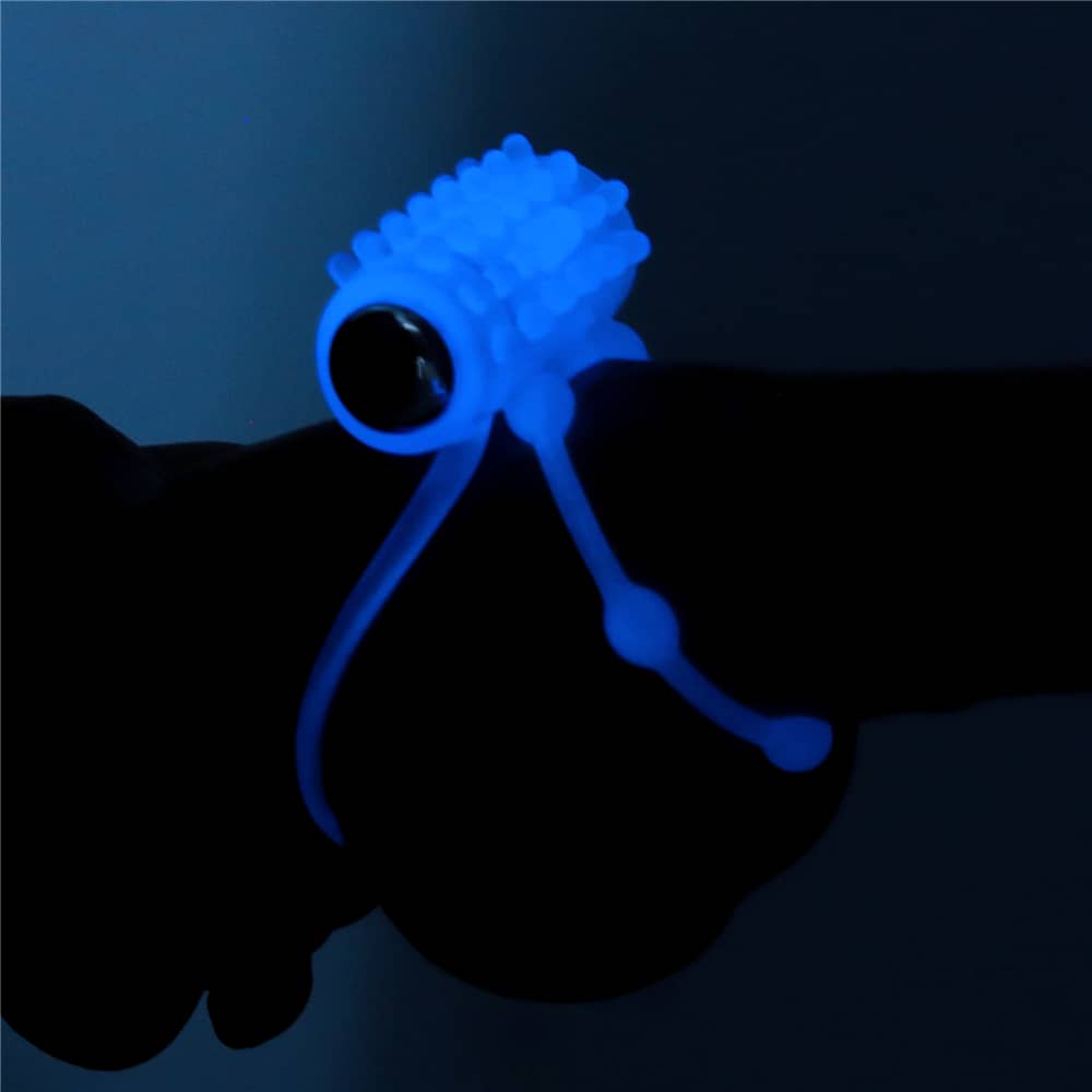The lumino play vibrating penis ring glows the blue light wearing on dildo