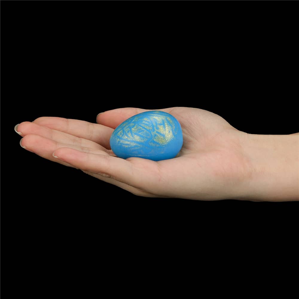 The smoothly textured ball of the oceans toner egg set is put on the palm