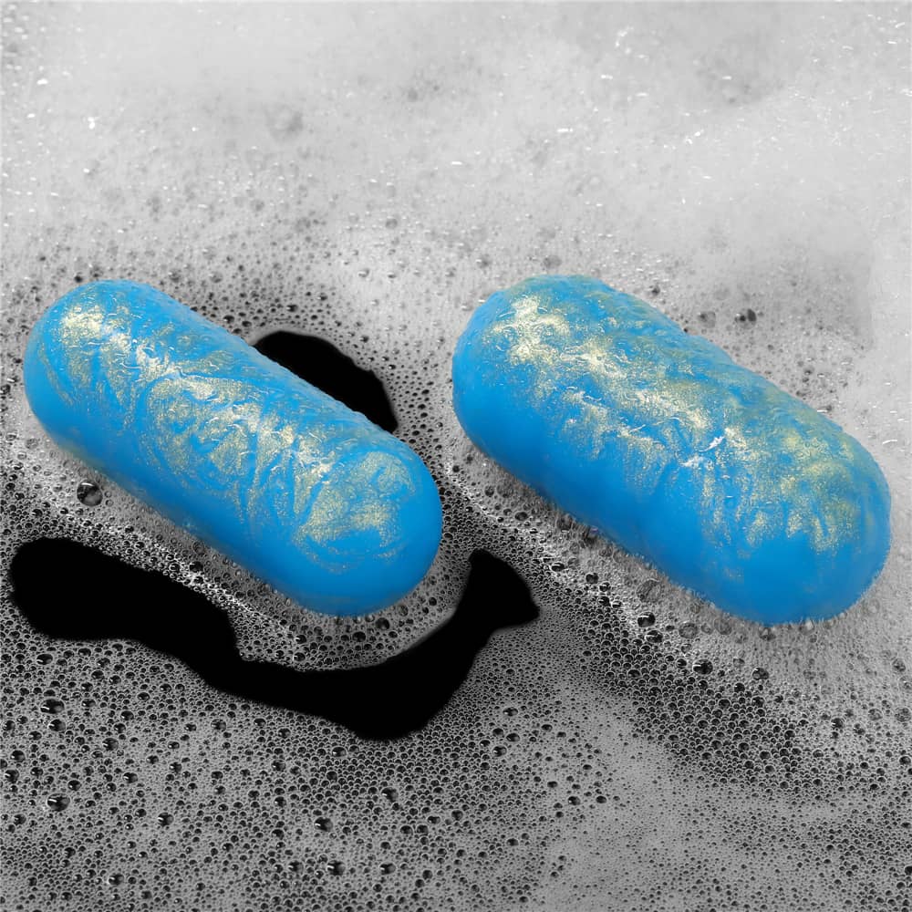 Two balls of the ocean toner egg set lay in bubble