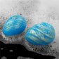 Two balls of the oceans toner egg set lay in bubble