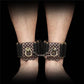 A person wears the rebellion reign ankle cuffs